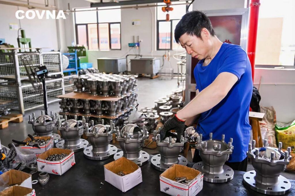 Valve body factory, workers are installing high quality flange ball valves